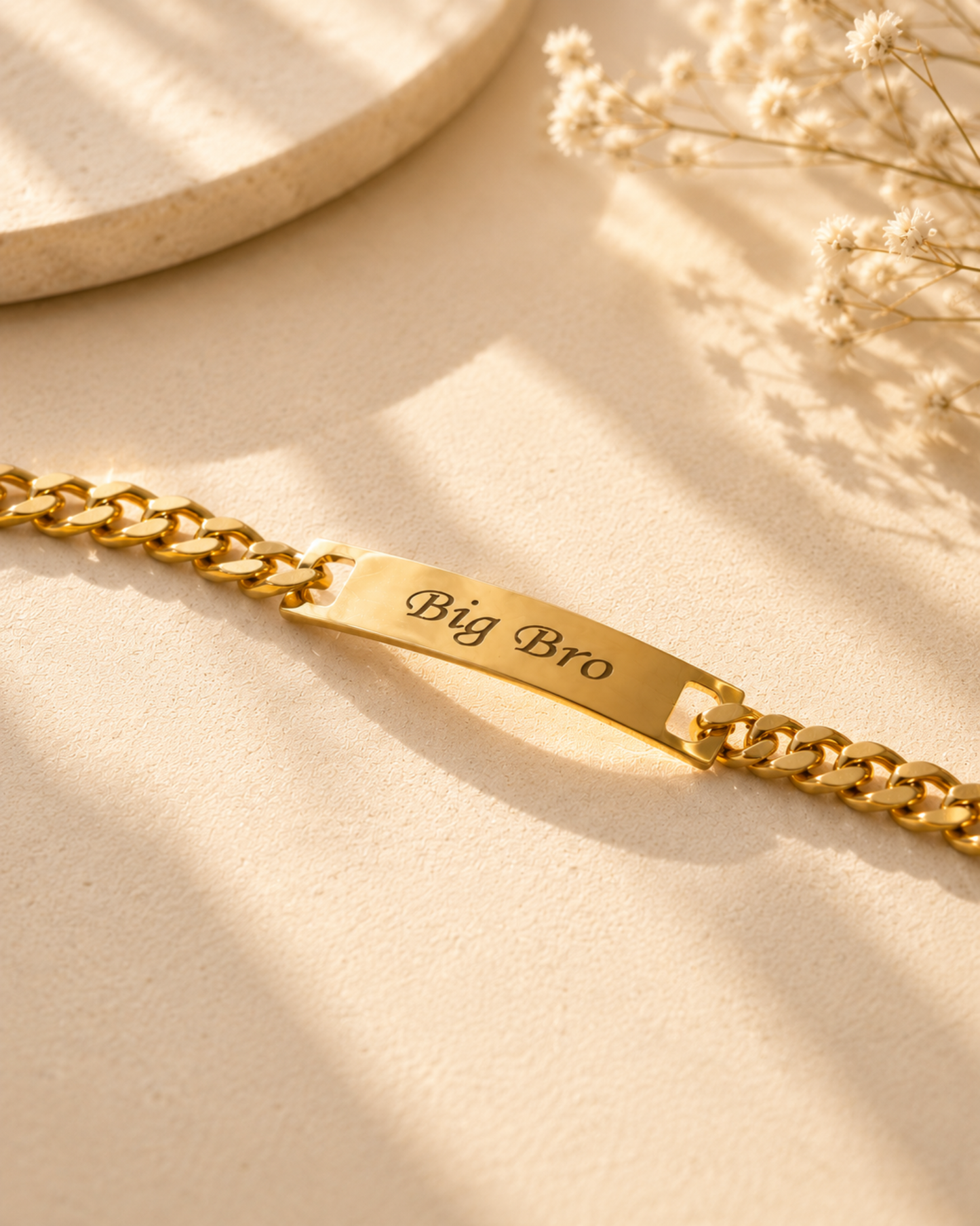 Gold engraved Big Bro bar bracelet on a clean background