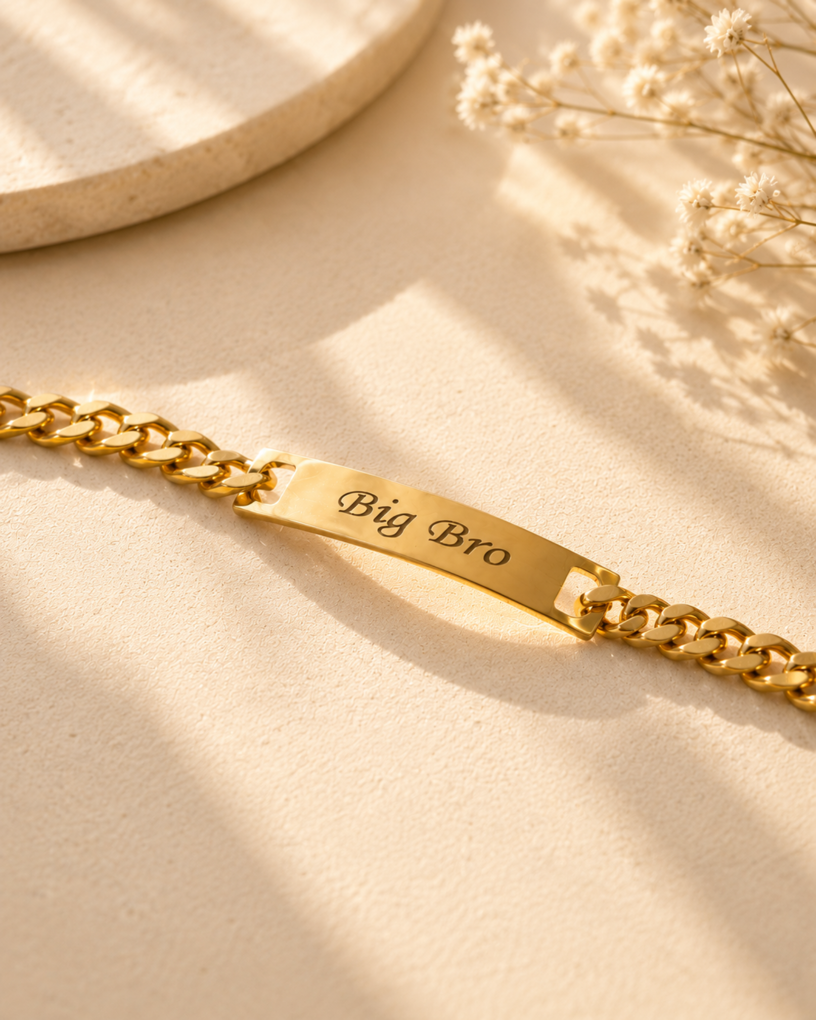Gold engraved Big Bro bar bracelet on a clean background